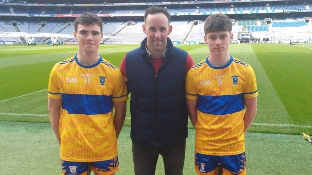 Coláiste Éinde manager, David Tierney, pictured with players Cian Corcoran, left, and Cian Cloherty, right. 
