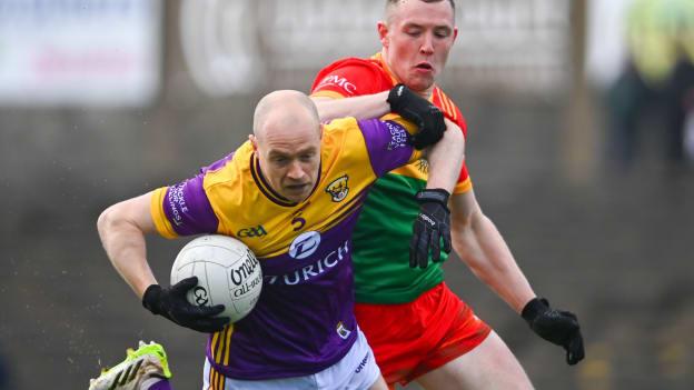 Kevin O'Grady, Wexford, and John Murphy, Carlow, in Leinster SFC action. Photo by Tyler Miller/Sportsfile