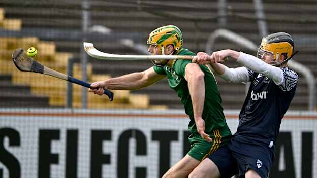 Dan Morrissey of Ireland races clear of Lachie Shaw of Scotland during the 2024 Hurling-Shinty International match between Ireland and Scotland at Cusack Park in Ennis, Clare. Photo by Ray McManus/Sportsfile