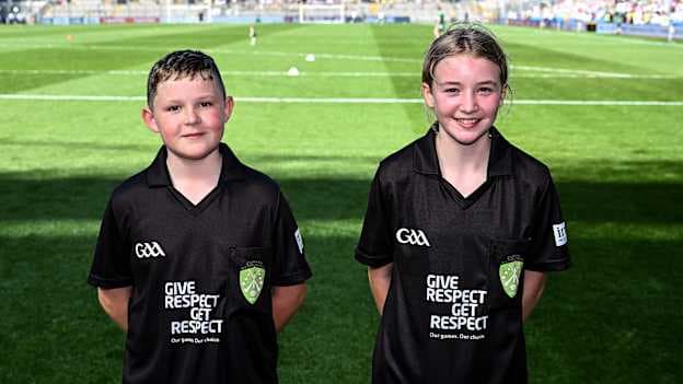 Referees Conor Carron of St Columban's Primary School, Belcoo, Fermanagh, and Orlaith Donohoe of St Mary's Primary School, Maguiresbridge, Fermanagh, before the GAA INTO Cumann na mBunscol Respect Exhibition Go Games match at the GAA Football All-Ireland Senior Championship semi-final match between Kerry and Tyrone at Croke Park in Dublin. Photo by Piaras Ó Mídheach/Sportsfile.