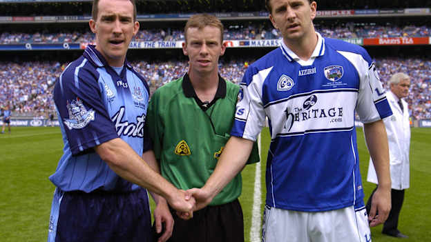 Dublin captain Paddy Christie, left, shakes hands with Laois captain Kevin Fitzpatrick, in the company of referee Joe McQuillan before the 2005 Leinster SFC Final. 