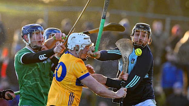 Oran Cahill of Clare is tackled by Diarmuid Stritch, left, and Limerick goalkeeper Colin Ryan during the Co-Op Superstores Munster Senior Hurling League match between Clare and Limerick at Páirc an Dálaigh in Tulla, Clare. Photo by Ray McManus/Sportsfile.