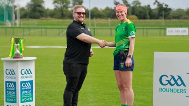 Junior Final Referee Jay Hall presents the match ball to Player of the Match Sandra Walsh of St. Kieran’s.
