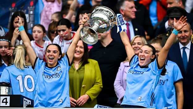 Dublin players Niamh Crowley, left, and Niamh Donlon lift the Brendan Martin cup after their side's victory in the TG4 All-Ireland Ladies Football Senior Championship final match between Dublin and Meath at Croke Park in Dublin. Photo by Seb Daly/Sportsfile.