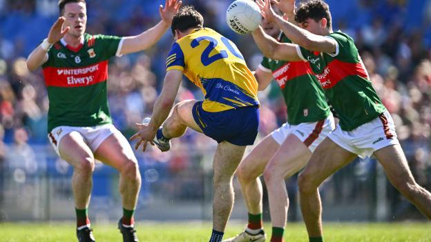 Ben O'Carroll of Roscommon has a shot blocked down by Tommy Conroy of Mayo, right, during the Connacht GAA Football Senior Championship semi-final match between Roscommon and Mayo at Dr Hyde Park in Roscommon. Photo by Piaras Ó Mídheach/Sportsfile.