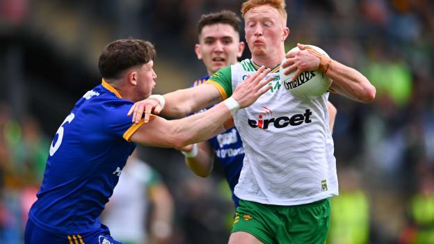 Oisín Gallen, Donegal, and Cillian Rouine, Clare, in All-Ireland SFC action. Photo by Ben McShane/Sportsfile