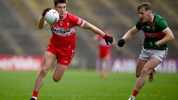 Conor Doherty, Derry, and Eoghan McLaughlin, Mayo, in All-Ireland SFC action at Hastings Insurance MacHale Park. Photo by Seb Daly/Sportsfile