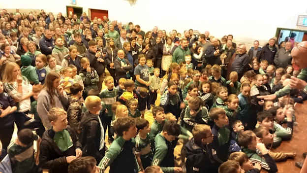 Aghabullogue supporters out in force to welcome home their double winning heroes. 