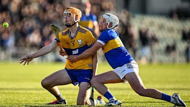 Robert Loftus, Clare, and Robbie Ryan, Tipperary, in Fulfil Munster U20 Hurling Championship Final action. Photo by David Fitzgerald/Sportsfile