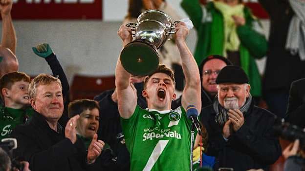 Maigh Cuilinn captain David Wynne lifts the Frank Fox Cup in October. Photo by Tyler Miller/Sportsfile