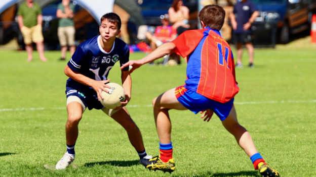 Victoria (navy) and South Australia under-17 boys at the Australasia Féile in Adelaide, March 2023.