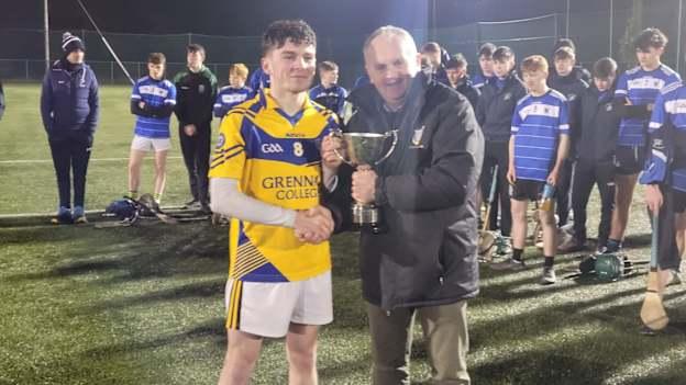 Grennan College captain, Alex Begley, accepts the Cup after his team's victory in the Leinster Final. 