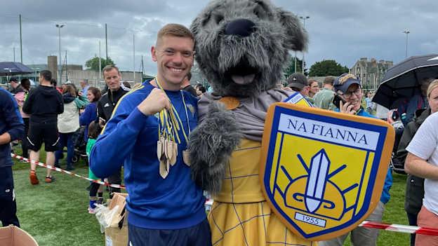 Na Fianna mascot Mobhi the Wolfhound pictured with club senior footballer, Al Fitzgerald.
