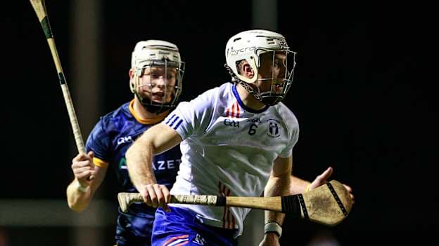 Jimmy Quilty, MICL, and Sam Byrne, DCU Dóchas Eireann, in Electric Ireland Fitzgibbon Cup action. Photo by Thomas Flinkow/Sportsfile