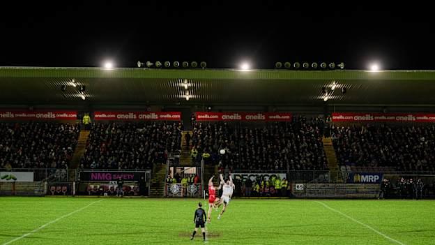 Anton Tohill, Derry, and Brian Kennedy, Tyrone, contest the throw-in at O'Neill's Healy Park. Photo by Ramsey Cardy/Sportsfile