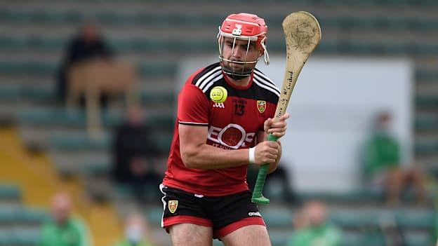 Five points from Pearse Óg McCrickard helped Down to a hard-fought victory over Kerry that sealed promotion from Division 2 for the Mourne County. 