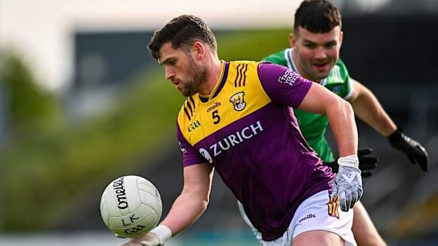 Liam O'Connor, Wexford, and Rory O'Brien, Limerick, in Tailteann Cup action. Photo by Piaras Ó Mídheach/Sportsfile