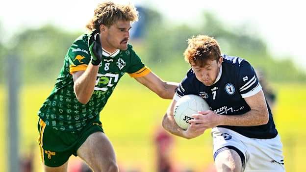 Joshua Johns of Australasia tackles his opponent during the International Football Division 1 match between Australasia and Delco Gaels Philadelphia on day two of the oneills.com GAA World Games 2026 at the SETU Arena in Carriganore, Waterford. Photo by Shauna Clinton/Sportsfile.