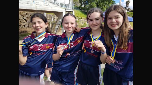 Some of the Vannes GAA club players celebrate with their medals after winning the Plate Final at the 2024 Gaelic Games Europe Féile. 