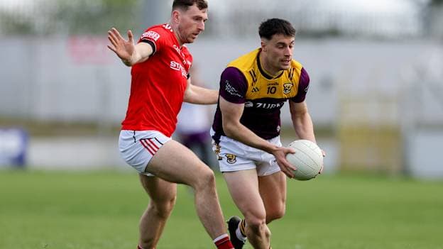 Páiric Hughes, Wexford, and Sam Mulroy, Louth, in Leinster SFC action. Photo by Michael P Ryan/Sportsfile