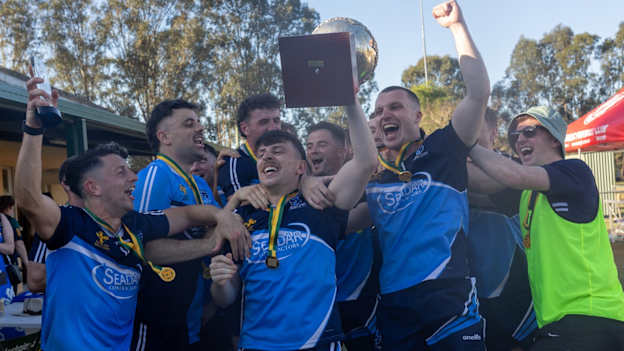 New South Wales captain Jack Hussey (Round Towers, Dublin) celebrates with his teammates following their 12-point senior football championship final win over Victoria. Photo: Julie-Anne Miller/An Astráil 