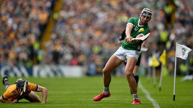 Gearóid Hegarty of Limerick scores a point despite the best efforts of David McInerney of Clare during the Munster GAA Hurling Senior Championship final match between Clare and Limerick at FBD Semple Stadium in Thurles, Tipperary. Photo by Brendan Moran/Sportsfile.