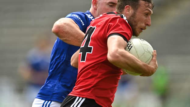 Barry O'Hagan of Down in action against Killian Brady of Cavan during the 2022 Tailteann Cup Round 1 match between Cavan and Down at Kingspan Breffni in Cavan. Photo by Oliver McVeigh/Sportsfile