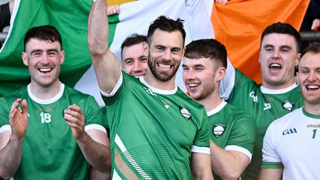 Ireland captain Neil McManus lifts the Mowi Quaich after his side's victory in the 2023 Hurling Shinty International Game between Ireland and Scotland at Páirc Esler in Newry, Down.