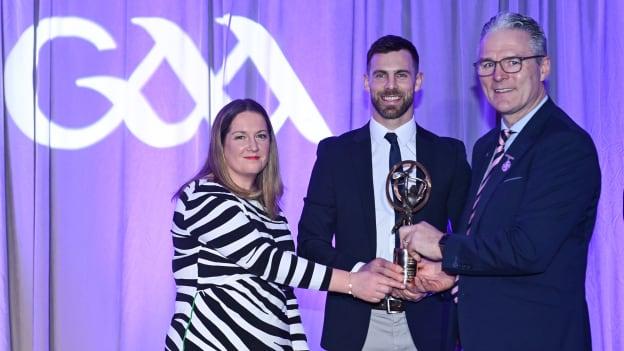 Neil McManus of Ruairi Óg, Cushendall, centre, is presented with his AIB GAA Club Hurling Team of the Year Award by AIB Head of Marketing Engagement Nuala Kroondijk and Uachtarán Chumann Lúthchleas Gael Jarlath Burns during the AIB GAA Club Players Awards, held at Croke Park in Dublin. Photo by Sam Barnes/Sportsfile.