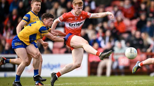 Declan Cassidy of Derry shoots to score his side's first goal despite the attention of Patrick Gavin of Roscommon during the Allianz Football League Division 1 match between Derry and Roscommon at Celtic Park in Derry. Photo by Ramsey Cardy/Sportsfile