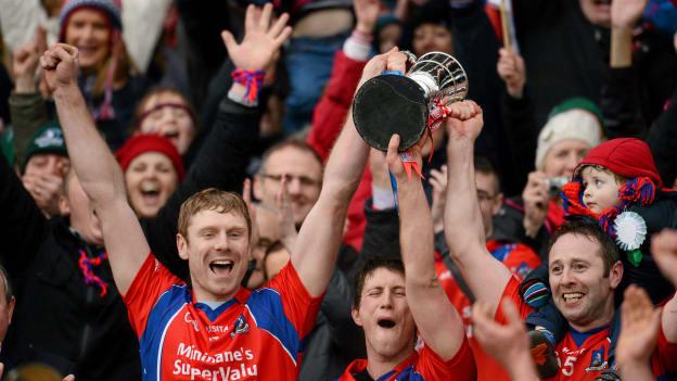 St. Thomas' captain Robert Murray, left, lifts the cup with Kenneth Burke, centre, and Enda Tannion with his son Matthew, age 2 after the 2013 AIB GAA Hurling All-Ireland Senior Club Championship Final against Kilcormac-Killoughey. Ray McManus / SPORTSFILE