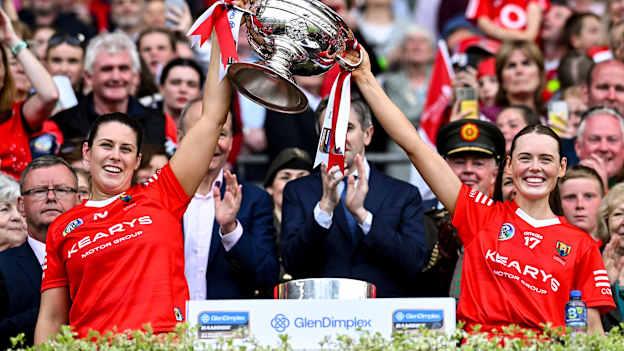 Cork joint-captains Molly Lynch and Meabh Cahalane lift the O'Duffy Cup after 2024 All-Ireland Senior Camogie Championship Final at Croke Park. Photo by Piaras Ó Mídheach/Sportsfile