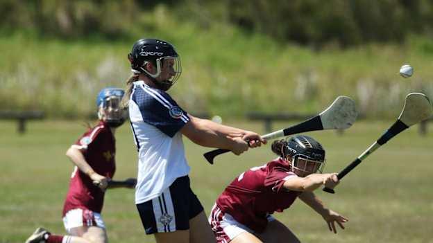 Victoria (left) and Queensland camogie at the 2016 Australasia Championships in Queensland. Camogie was first played at the interstate championships in 2011. Photo credit: Darken Sportz.