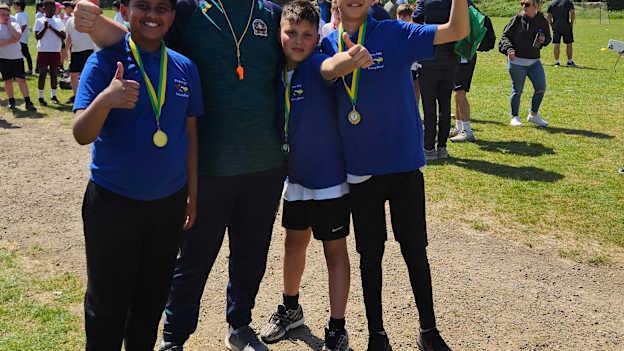 Hertfordshire Community Development Administrator, Keith Jackman, pictured at the 2025 All Herts Competition with three young participants. 