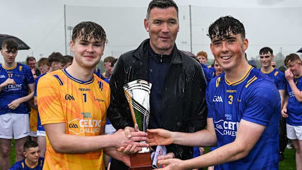 National Head of Hurling William Maher, centre, presents the Corn Michael Feery to Longford joint captains Conor Tiernan, left, and Ryan Murphy, right, after the Electric Ireland Celtic Challenge Corn Michael Feery final match between Longford and Fermanagh at the GAA National Games Development Centre in Abbotstown, Dublin. Photo by Paul Phelan/Sportsfile.