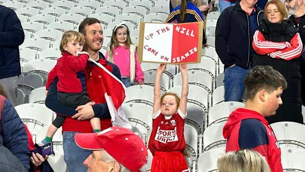 A young Watergrasshill supporter hails the club's victorious hurlers after their win in the Cork Premier Intermediate Hurling Championship Final. 