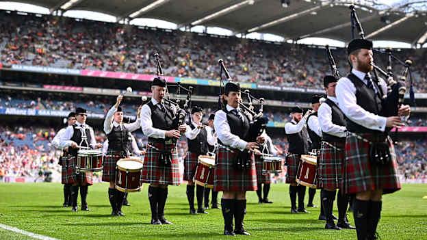 GAA journalist Pat Nolan with the St Joseph's Pipe Band from Clondalkin performing at Croke Park last Sunday. Photo by Piaras Ó Mídheach/Sportsfile