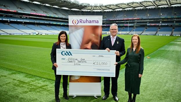 Uachtarán Chumann Lúthchleas Gael Jarlath Burns pictured with Charity partner representatives from Ruhama, Chief Executive Barbara Condon, and Policy and Communications Coordinator Danielle McLaughlin.