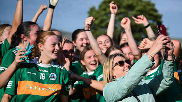 Claregalway supporter Anne Fahy takes a selfie with players after their side's victory in the LGFA Division 1 final match between Claregalway and Ballinderry Shamrocks at the John West Féile Peile na nÓg Gaelic Football and LGFA National Finals at Derry GAA Centre of Excellence in Owenbeg, Derry. Photo by Shauna Clinton/Sportsfile.