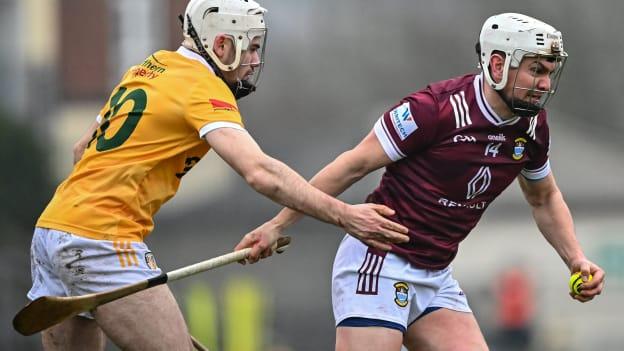 Joseph Boyle, Westmeath, and Ronan McAteer, Antrim, in Allianz Hurling League action. Photo by Piaras Ó Mídheach/Sportsfile
