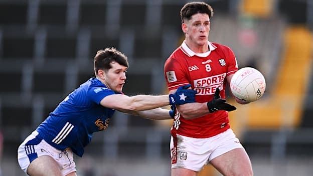 Colm O'Callaghan, Cork, and Paddy Meade, Cavan, in Allianz Football League action. Photo by Ben McShane/Sportsfile