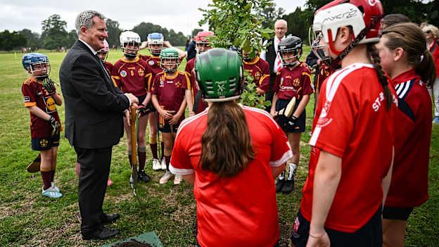 Minister of State Kieran O'Donnell TD with members of St Oliver Plunkett Eoghan Ruadh and St Brigid's GAA clubs during the planting on an oak tree at the Launch of Clann of Gaelic Games exhibition at Phoenix Park visitor centre marking the 140, 120 and 50 anniversaries of the GAA, Camogie and LGFA and unveiling a plaque to mark the venue of the 1893 GAA All-Ireland finals in the Park. Photo by Harry Murphy/Sportsfile