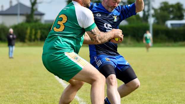 Justin Burns of Carrickmacross in action against Owen Roe O'Reilly of Erne Eagles. 