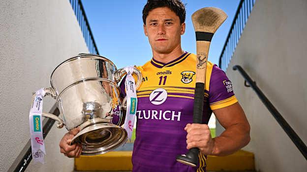 Wexford hurler Lee Chin poses for a portrait with the Bob O'Keeffe Cup at the launch of the 2025 Leinster GAA Senior Hurling Championship at UPMC Nowlan Park in Kilkenny. Photo by Sam Barnes/Sportsfile.