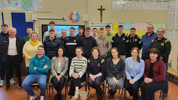 Upperchurch-Drombane hurlers pictured with members of staff of Scoil Iosagáin school after visiting with the Tipperary and Munster Premier Intermediate Hurling Cups. 