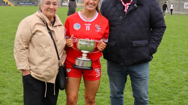 Shinrone captain, Sharon Shanahan, pictured with her parents Mary and Philip after victory in the Offaly Senior Camogie Final. 