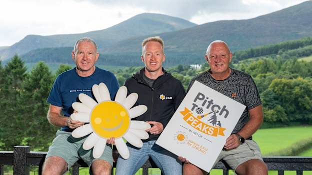 Pictured (l-r) former Down footballer, Ross Carr, Regional Community Fundraiser & Engagement Lead at Cancer Fund for Children, Cormac McMullan, and former Antrim hurler, Terence McNaughton, at Cancer Fund for Children’s therapeutic short break centre, Daisy Lodge, nestled at the foot of the Mourne mountains in Co. Down.

