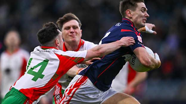Michael Fitzsimons of Cuala is tackled by Robbie Bolger, left, and Eamon Hill of Ballymun Kickhams during the Dublin County Senior Club Football Championship semi-final match between Ballymun Kickhams and Cuala at Parnell Park in Dublin. Photo by Ben McShane/Sportsfile.