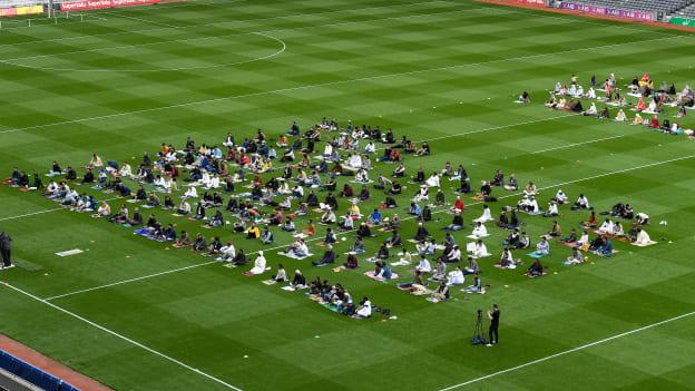 Muslim worshipers join Shaykh Dr Umar Al-Qadri as they offer Eid al-Adha prayers on the pitch in Croke Park during the celebration of Eid Al-Adha at Croke Park in Dublin. Photo by Ray McManus/Sportsfile.