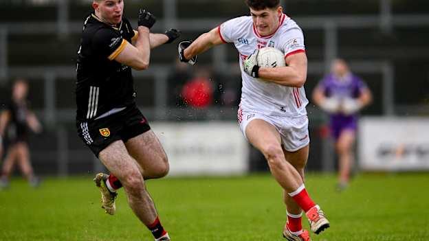 Sean McDonnell, Cork, and Peter Fegan, Down, in Allianz Football League action. Photo by Ramsey Cardy/Sportsfile